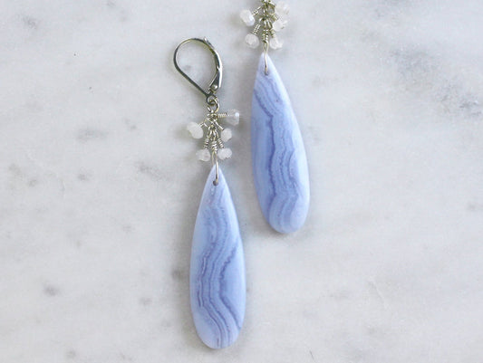 Blue lace agate teardrop earrings with moonstone clusters on sterling silver lever back ear wires.