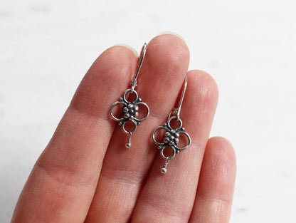 silver quatrefoil flower earrings on lever back ear wires