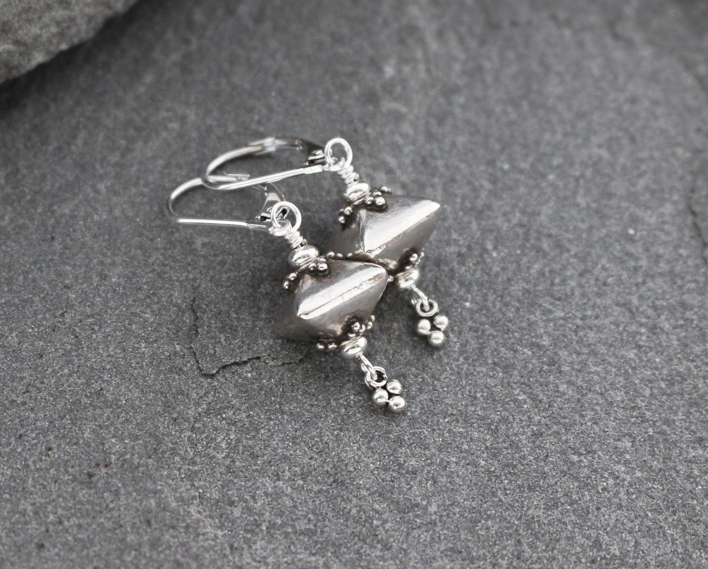 Bali sterling silver geometric dangle earrings on lever backs ear wires.