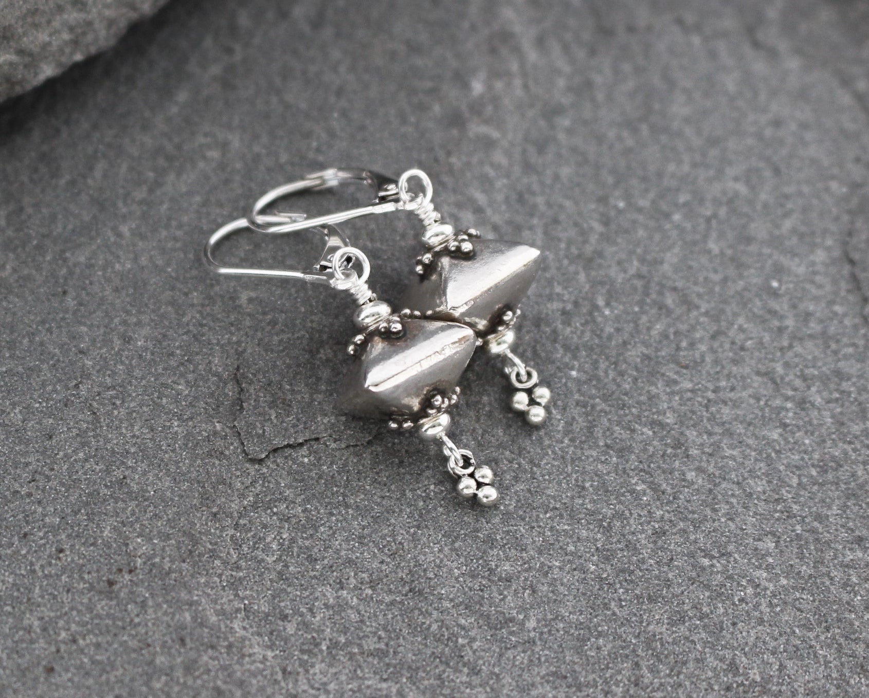 Bali sterling silver geometric dangle earrings on lever backs ear wires.