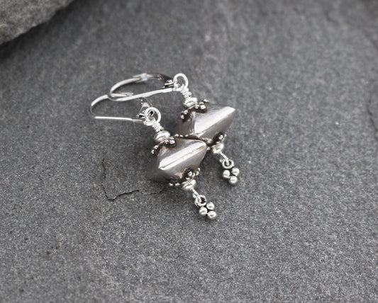 Bali sterling silver geometric dangle earrings on lever backs ear wires.